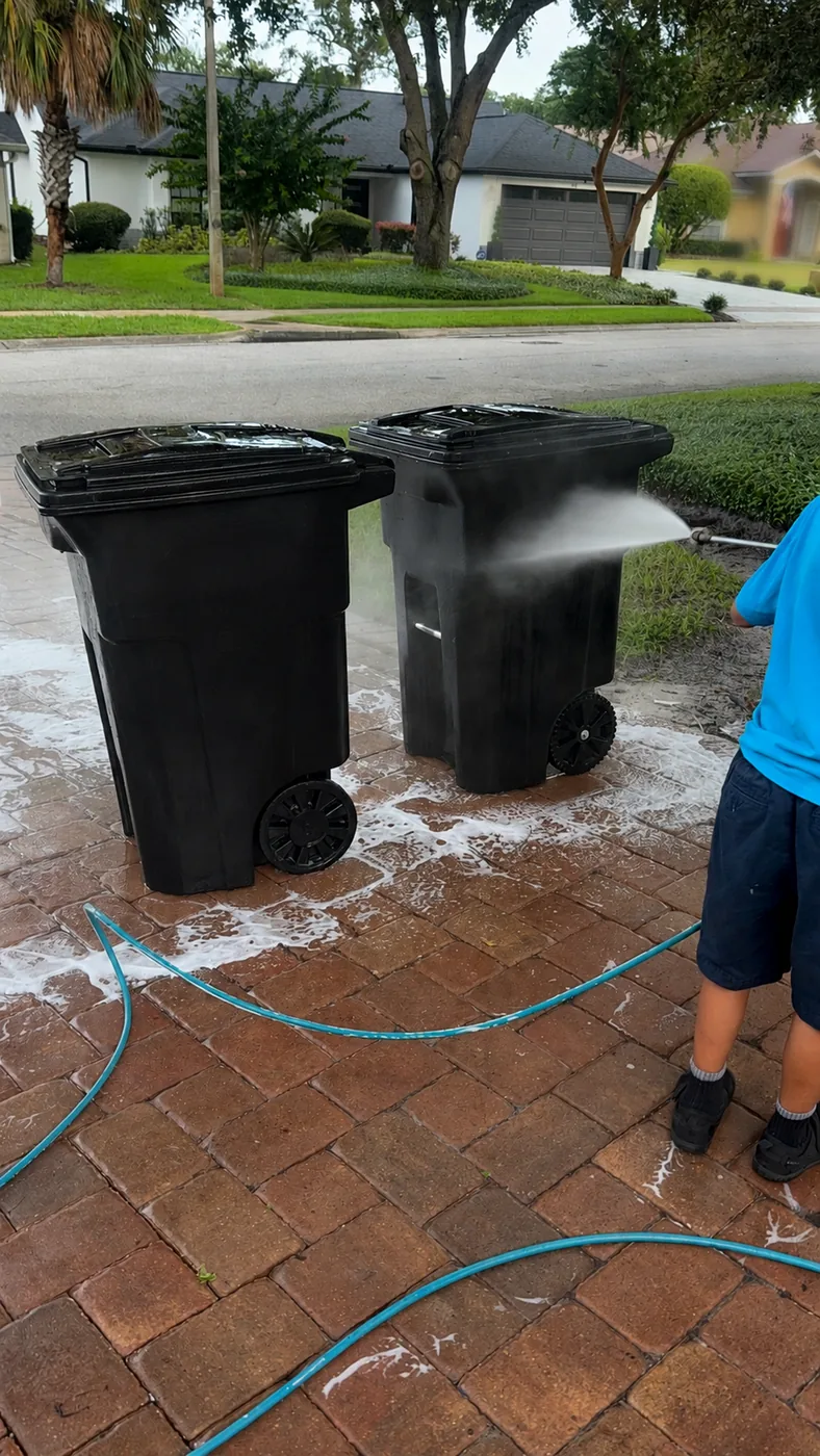 Pressure washing the outside of trash bins